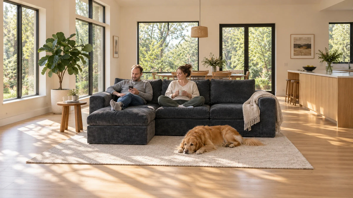 MONVANE Cushioned Modular Sofa (4 Seats) in dark grey crushed velvet set as an L with an ottoman chaise on one cream rug