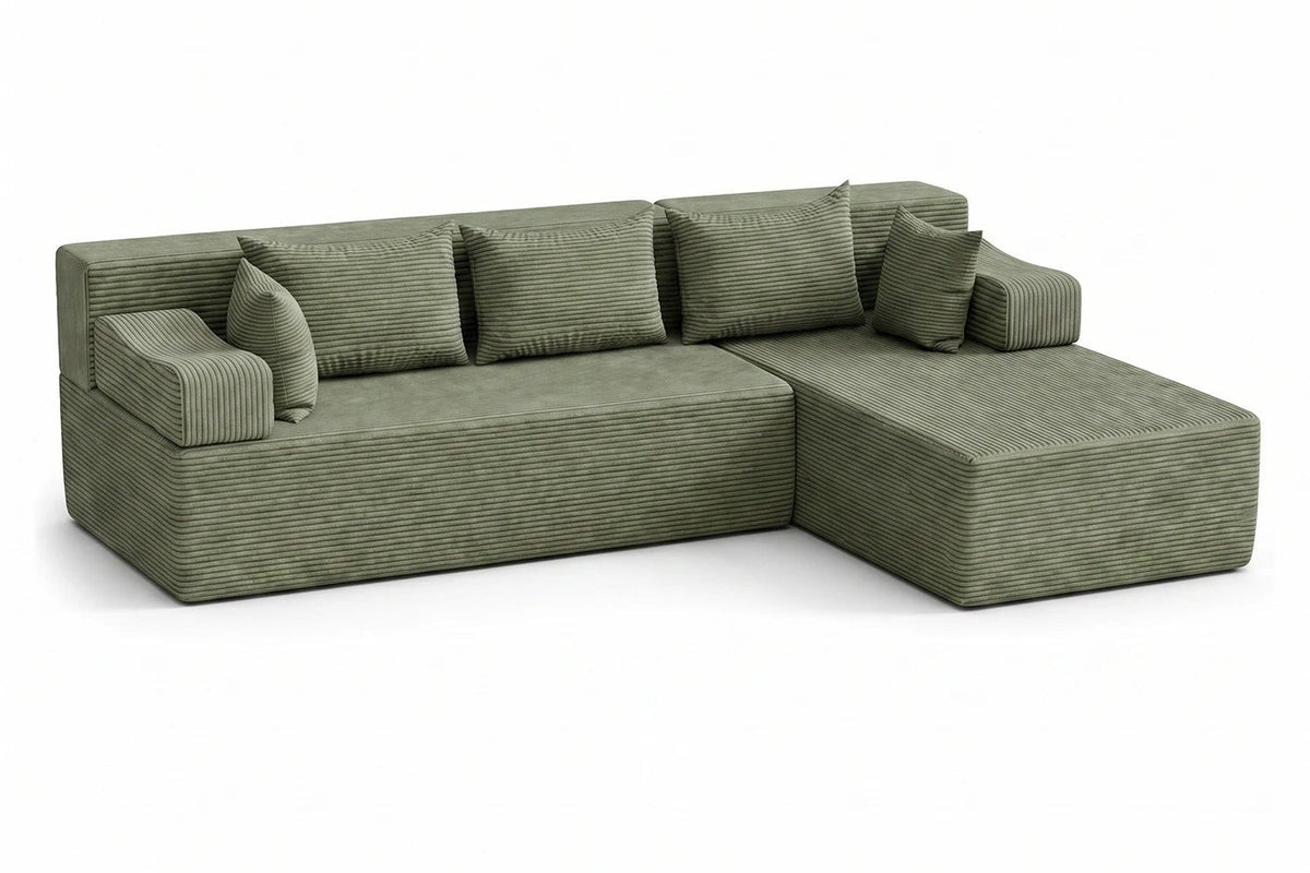 Green corduroy Monvane L-shaped sectional shown in one completed arrangement.