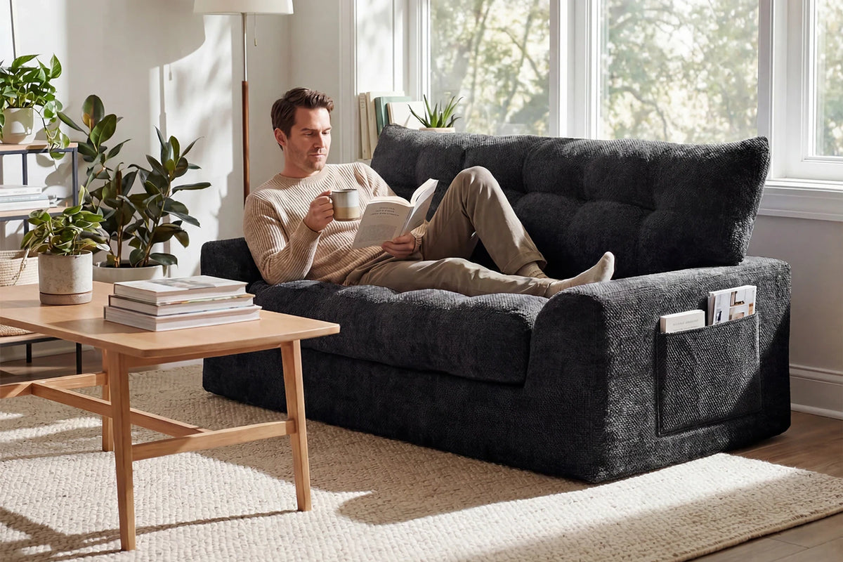 Two Adults Sitting on Monvane Black Boneless Chenille 2-Seater Loveseat in Apartment