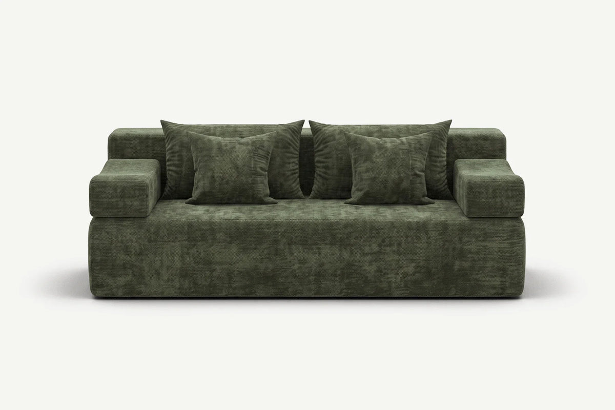 Green Monvane loveseat with two main back cushions and loose pillows on a white background.