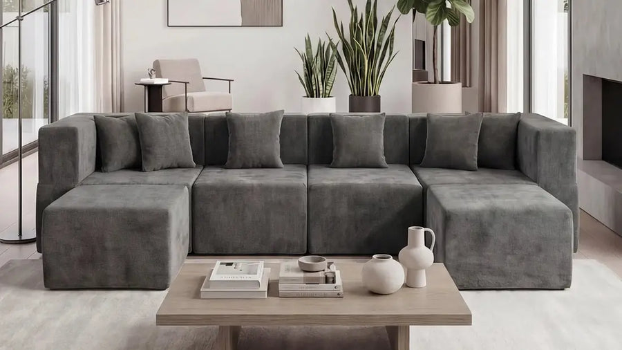 Gray modular sectional arranged as a U-shaped seating area in a living room.