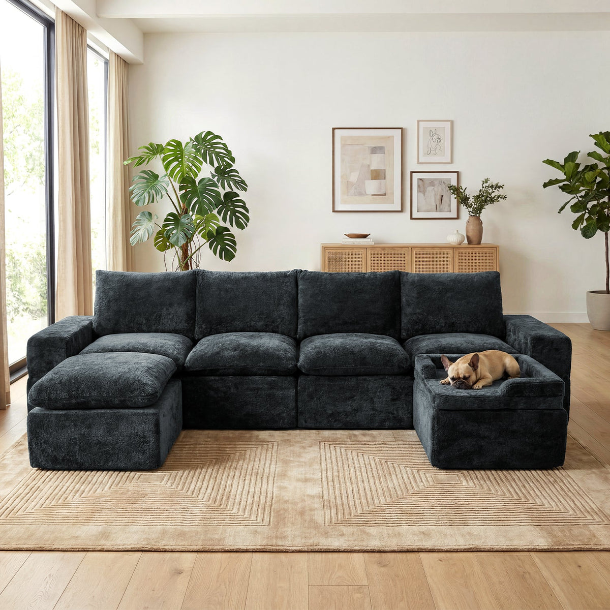 Small tan dog sleeping in a raised side zone of a dark-gray modular sofa.