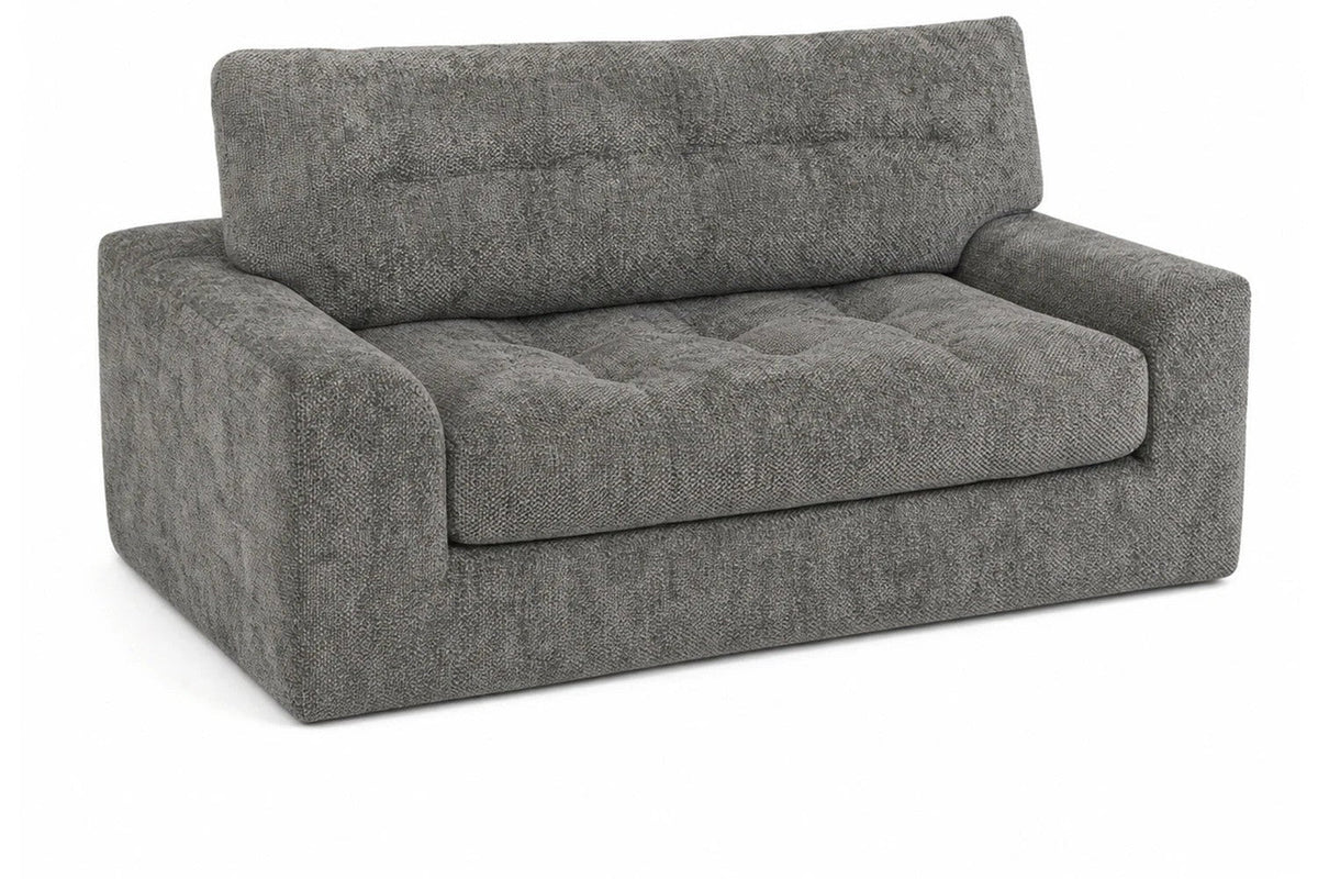 Dark-gray Monvane loveseat with one visibly continuous tufted seat surface.