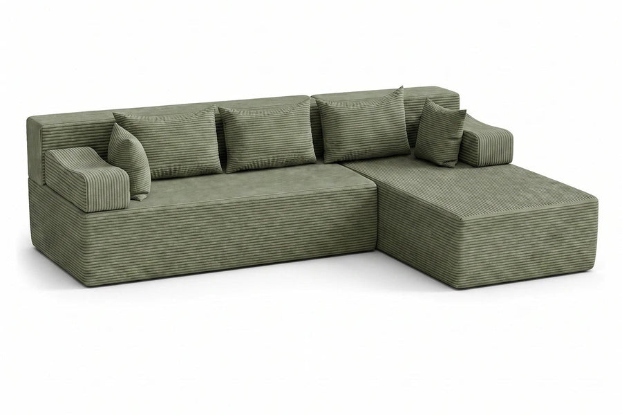 Green corduroy Monvane L-shaped sectional shown in one completed arrangement.