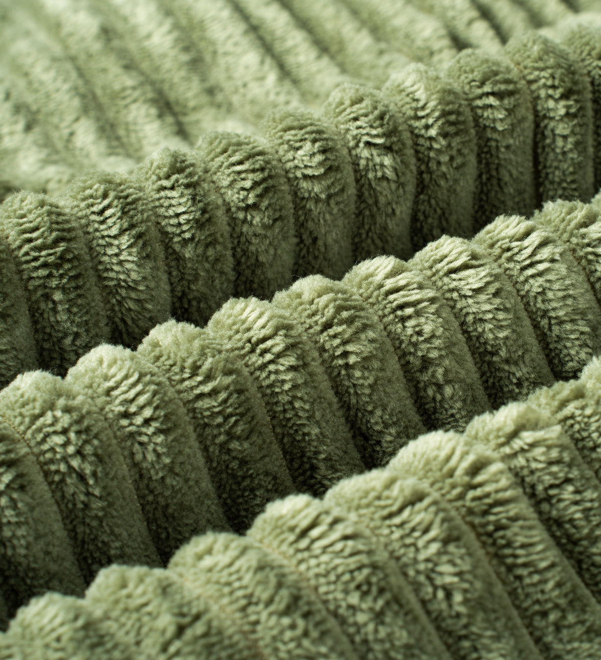 Close view of green corduroy Monvane upholstery