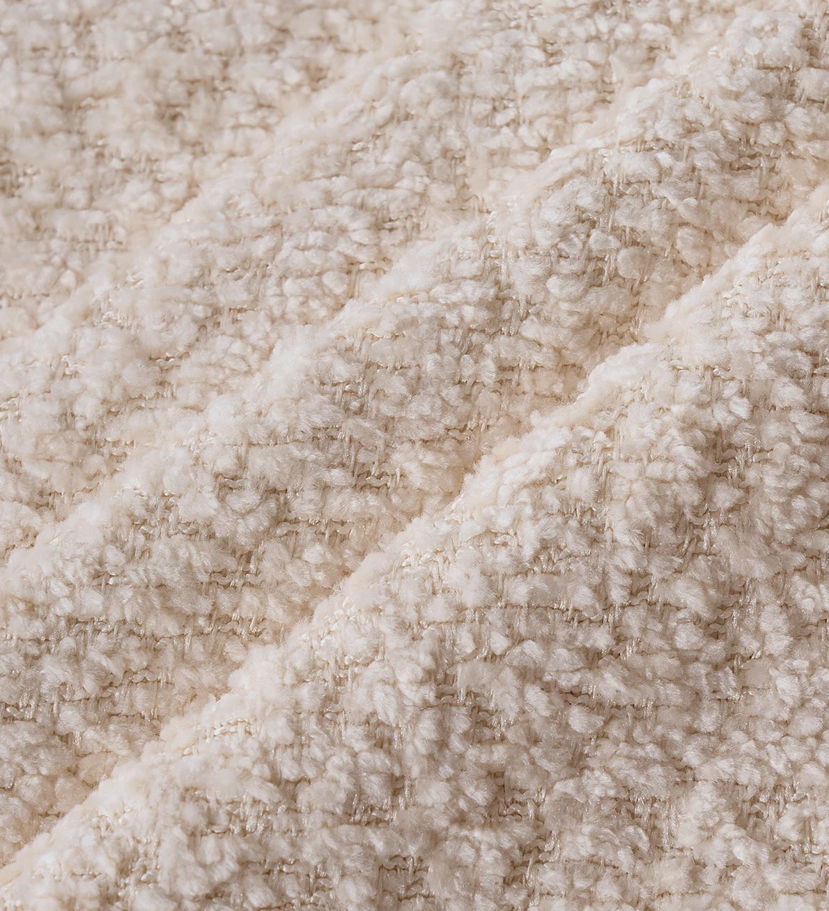 Close view of warm teddy velvet Monvane upholstery
