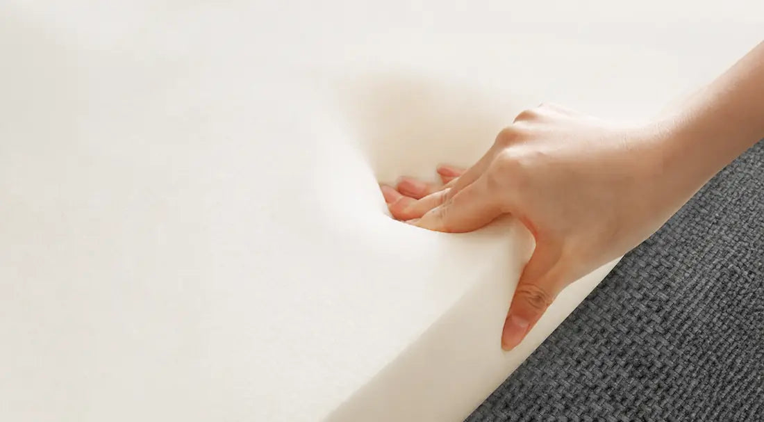 Close view of foam cushioning being pressed